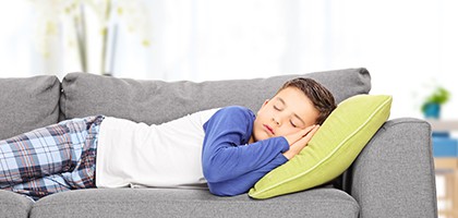 wellness orthodontics child sleeping on couch