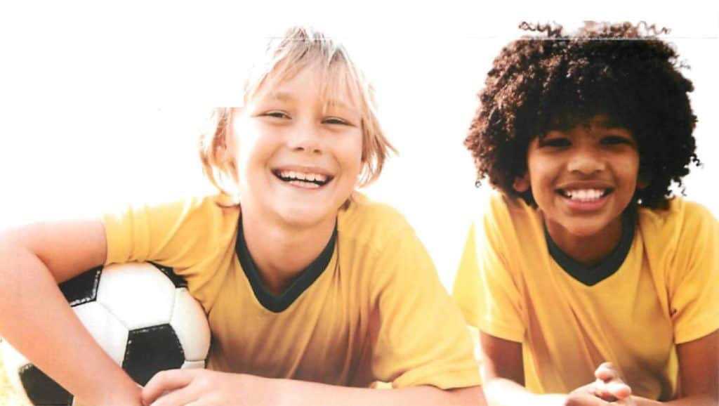 wellness orthodontics happy boys with soccer ball